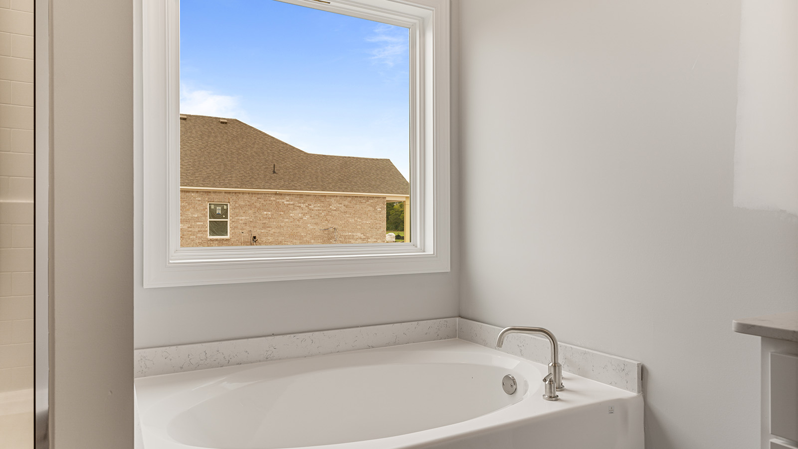luxury vinyl plan flooring in bathrooms with quartz countertops