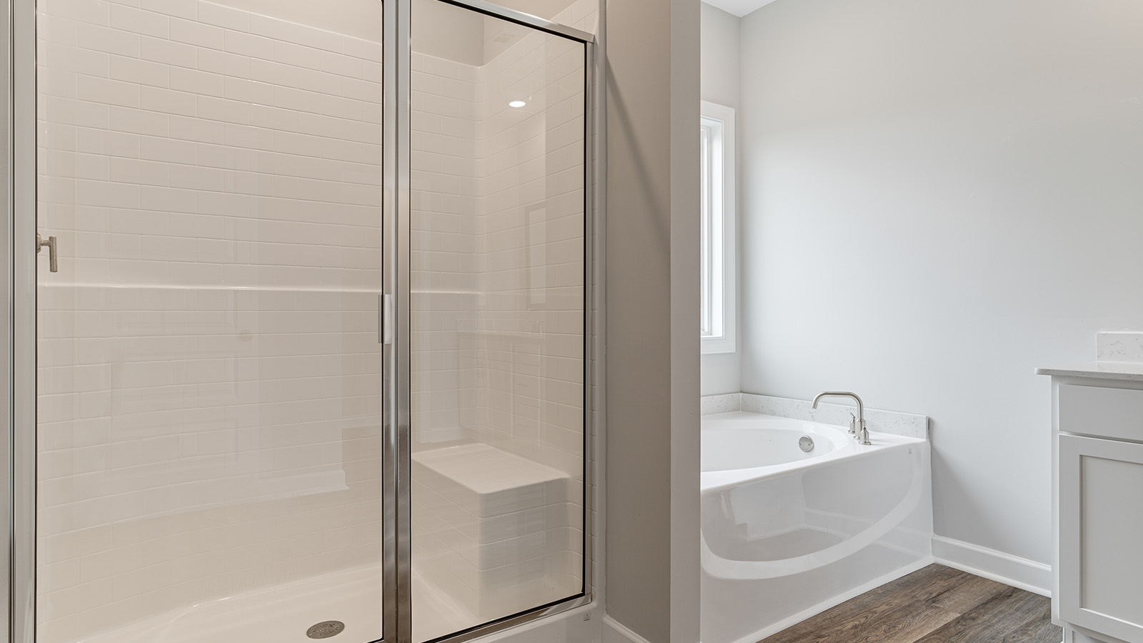 luxury vinyl plan flooring in bathrooms with quartz countertops
