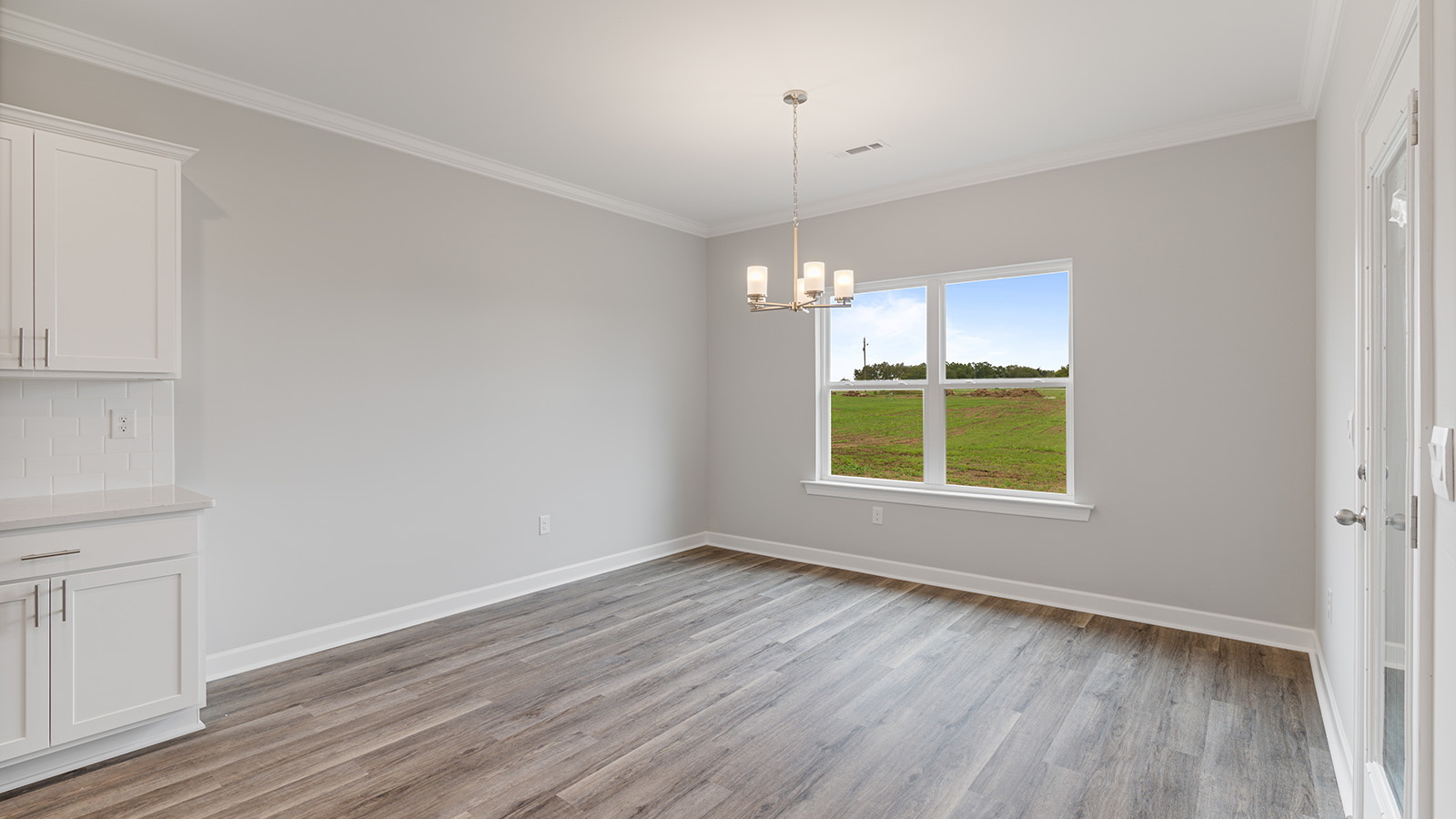 The Hawthorne floorplan kitchen with quartz countertops, soft close cabinets, and LVP flooring