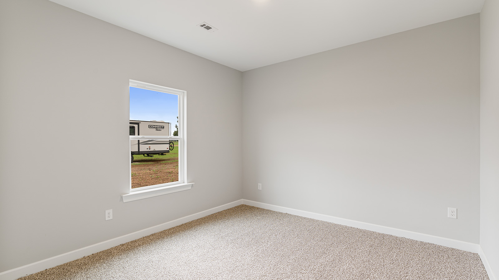 The Hawthorne floorplan bedroom with carpet and a ceiling fan