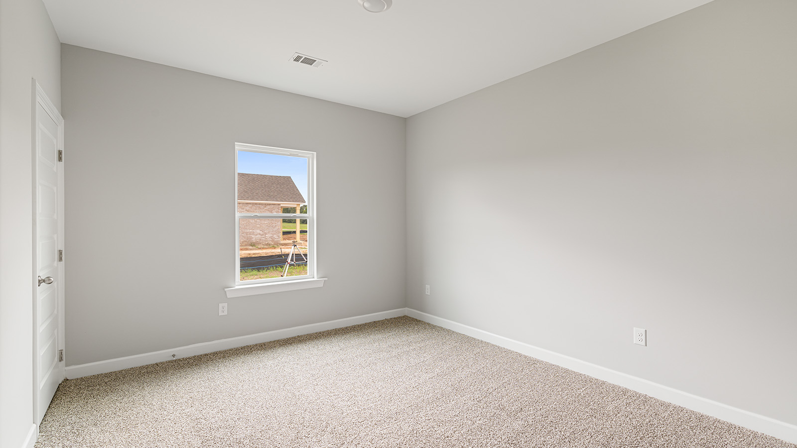 The Hawthorne floorplan bedroom with carpet and a ceiling fan