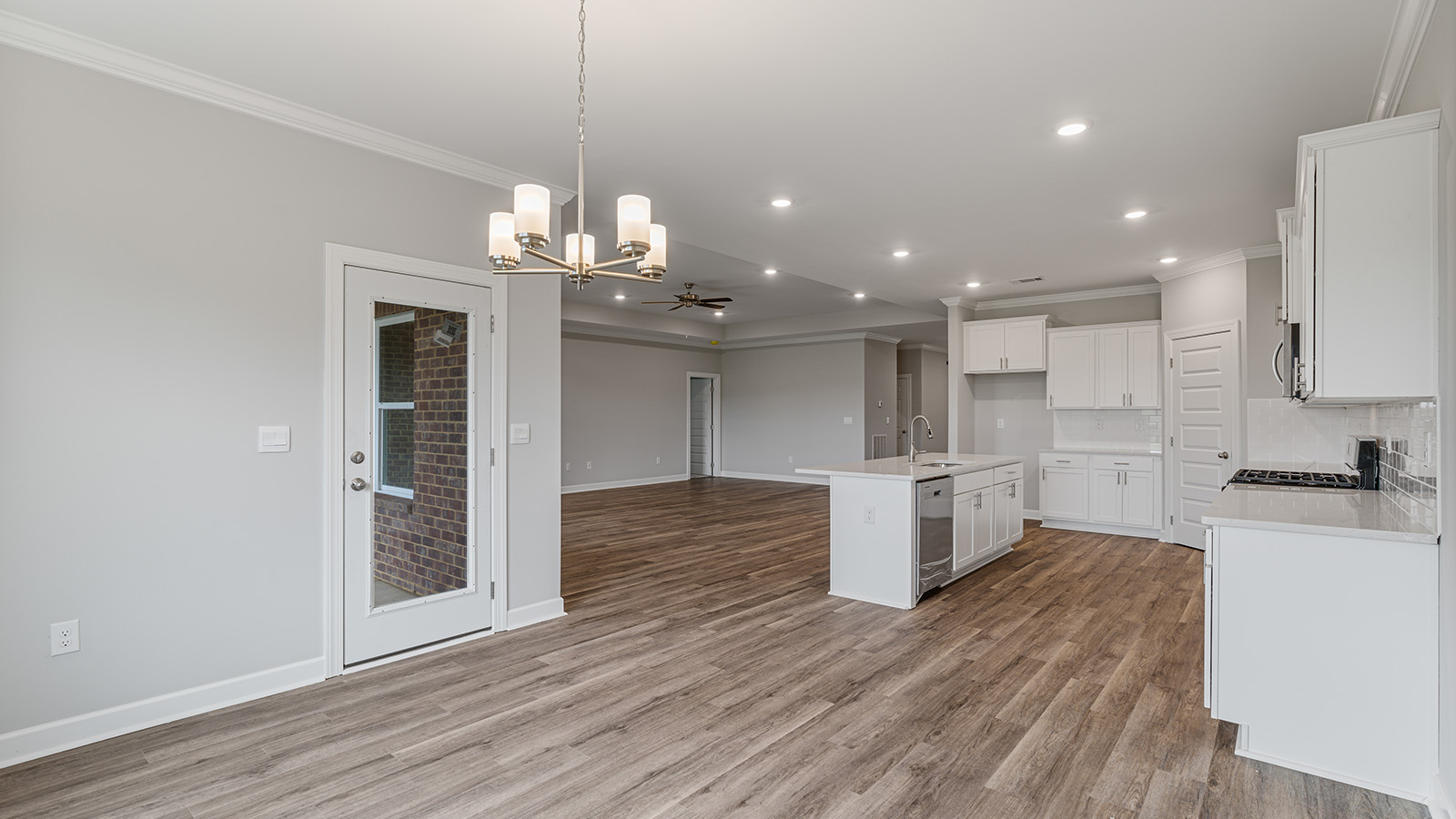 The Hawthorne floorplan kitchen with quartz countertops, soft close cabinets, and LVP flooring