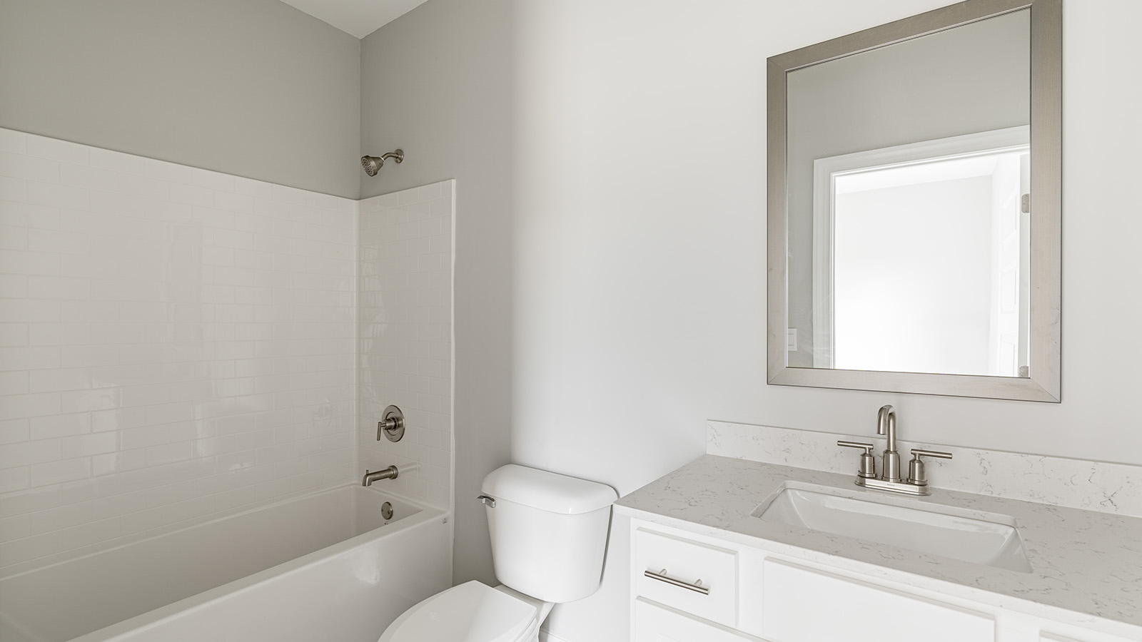 The Hawthorne floorplan bathroom with quartz countertops and LVP flooring