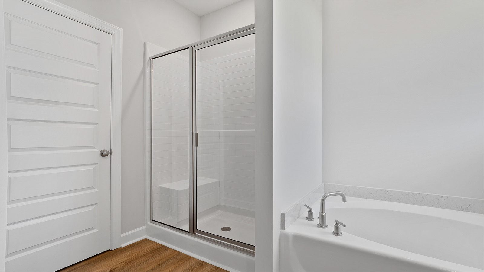 luxury vinyl plan flooring in bathrooms with quartz countertops
