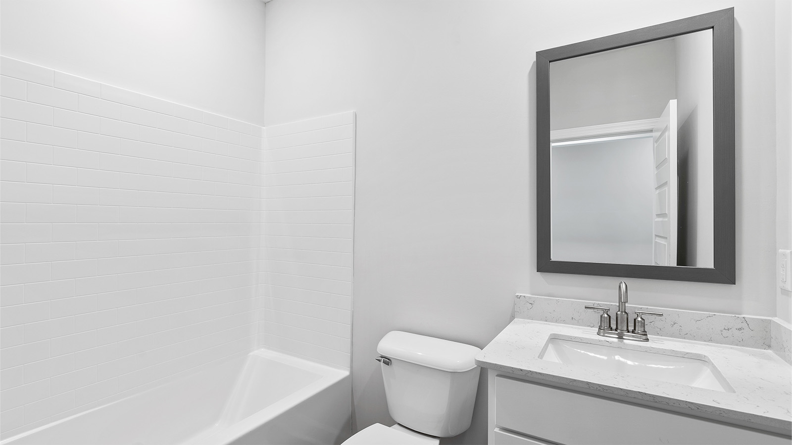 luxury vinyl plan flooring in bathrooms with quartz countertops