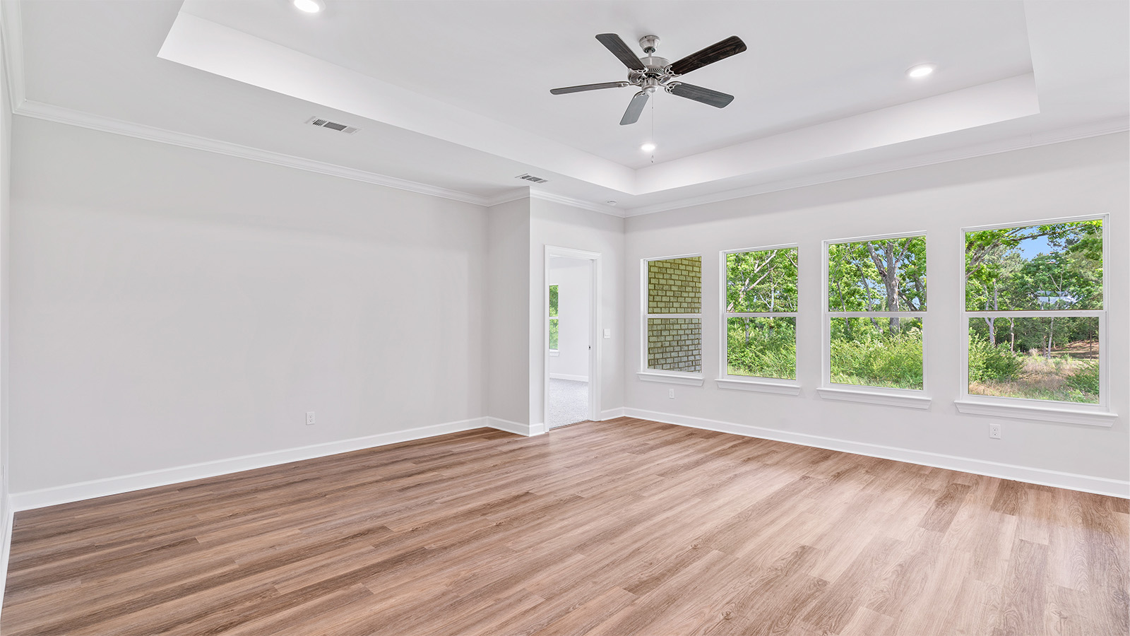 The Madison floorplan kitchen with quartz countertops, soft close cabinets, and LVP flooring