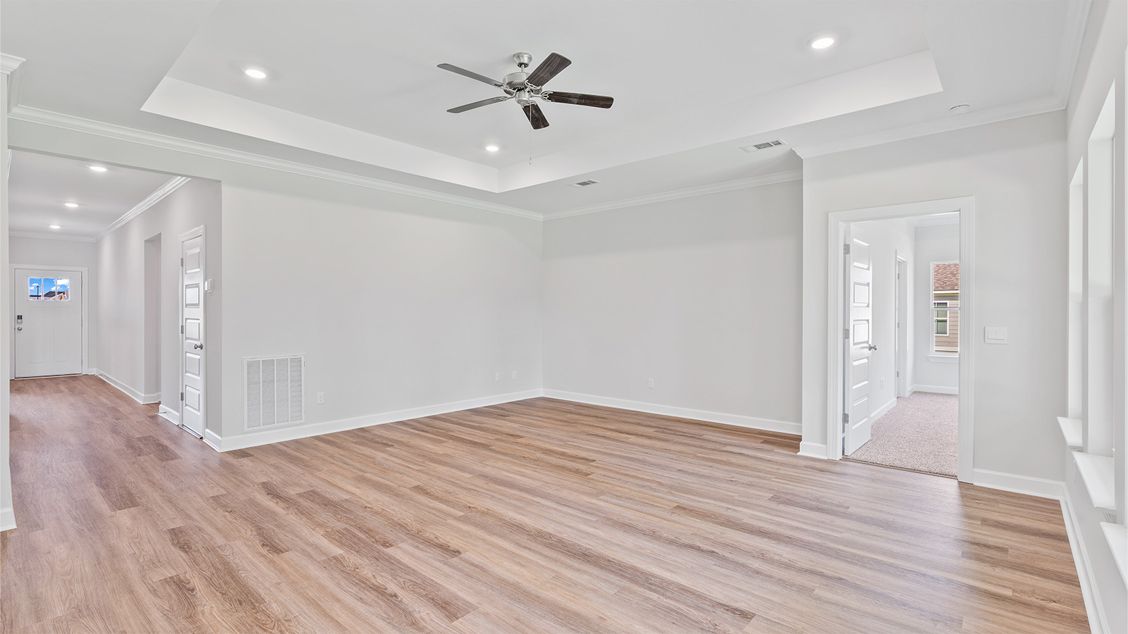 The Madison floorplan kitchen with quartz countertops, soft close cabinets, and LVP flooring