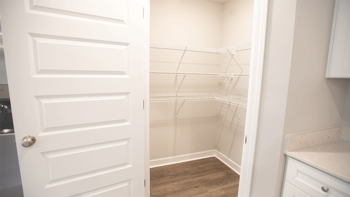 luxury vinyl plank flooring in kitchen with stainless steel appliances and Quartz countertops with soft close cabinets