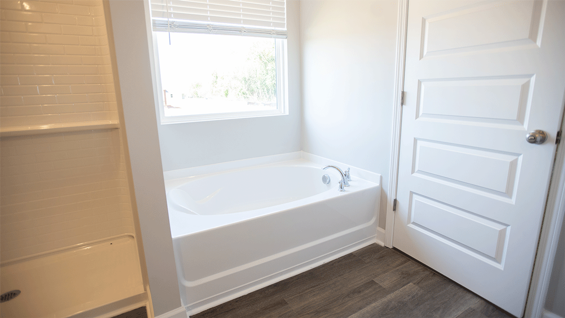 The Oxford floorplan bathroom with LVP flooring and quartz countertops