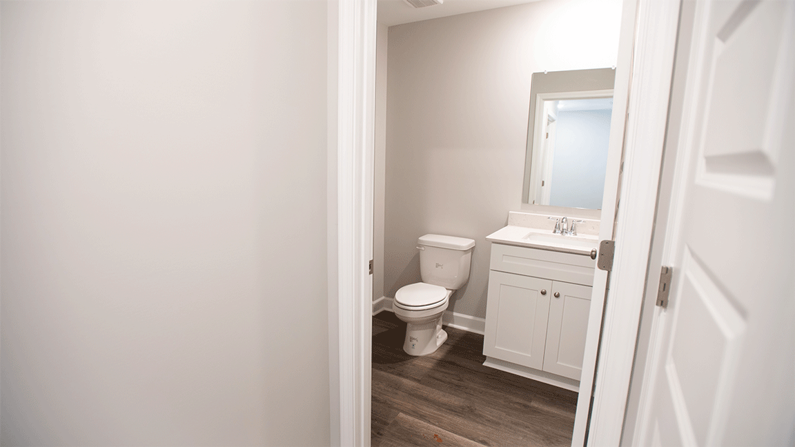 The Oxford floorplan bathroom with LVP flooring and quartz countertops