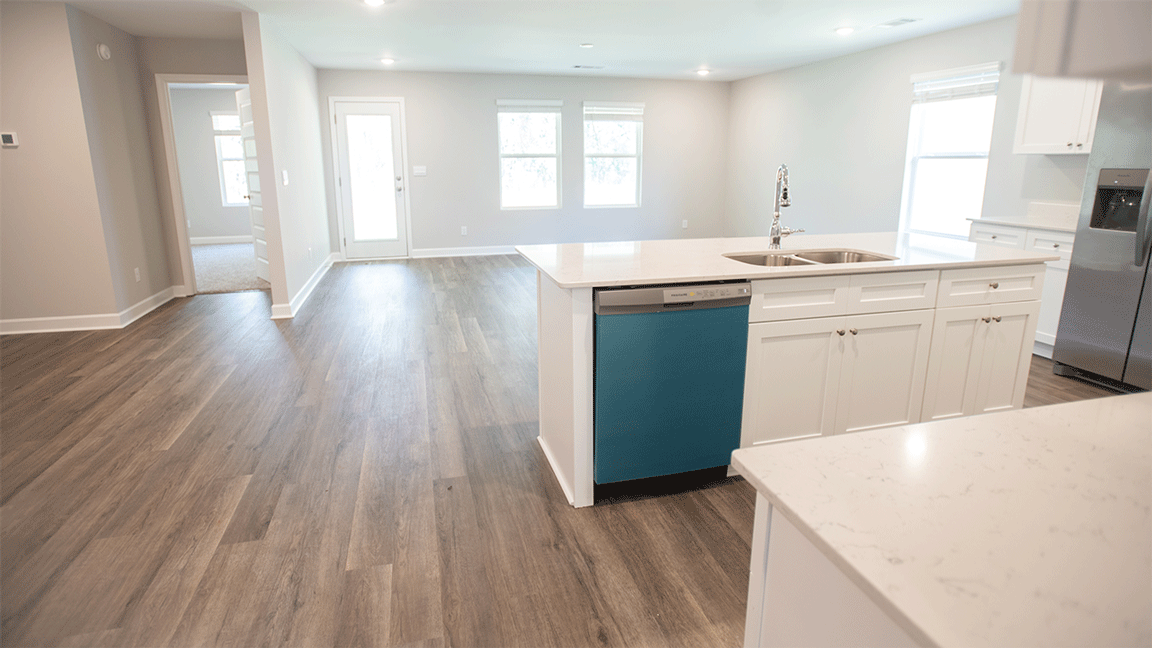 The Oxford floorplan kitchen with LVP flooring and quartz countertops
