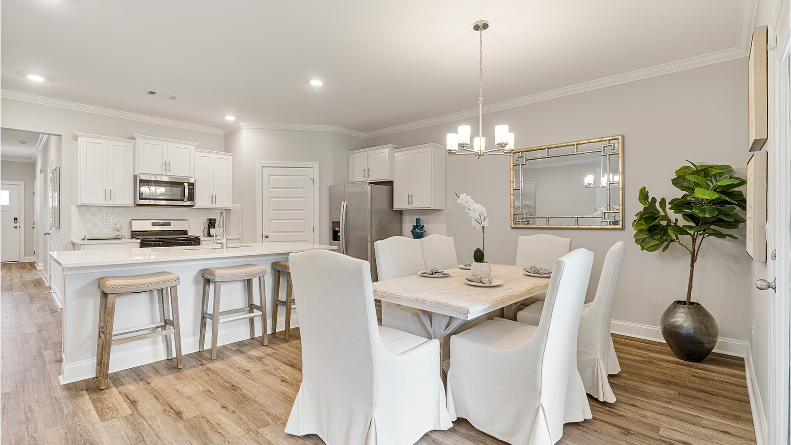 Rhett floorplan kitchen with quartz countertops, soft close cabinets, and LVP flooring