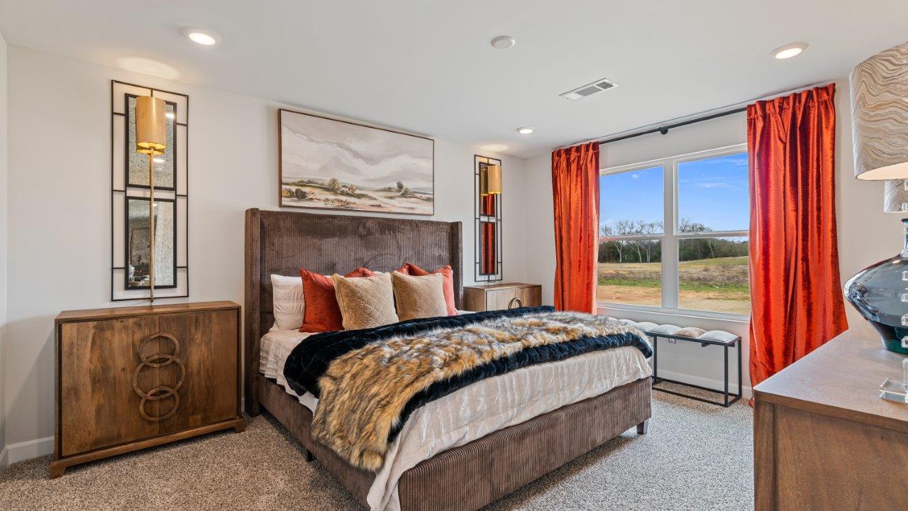 Large primary suite with walk in closet and private bath