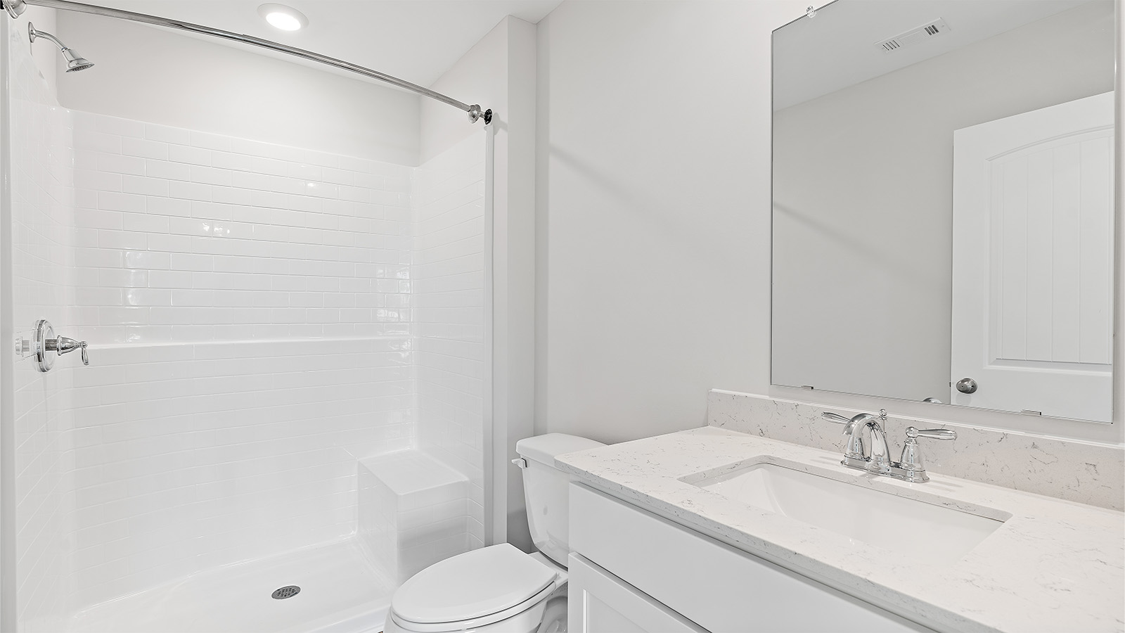 Modern bathroom with quartz vanity and sleek finishes