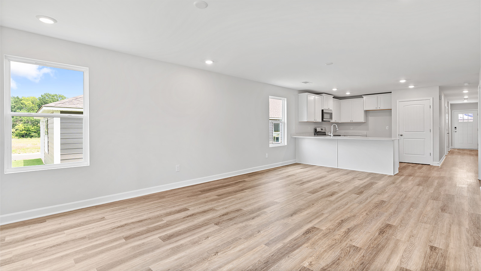 Open family room with abundant natural light and LVP throughout