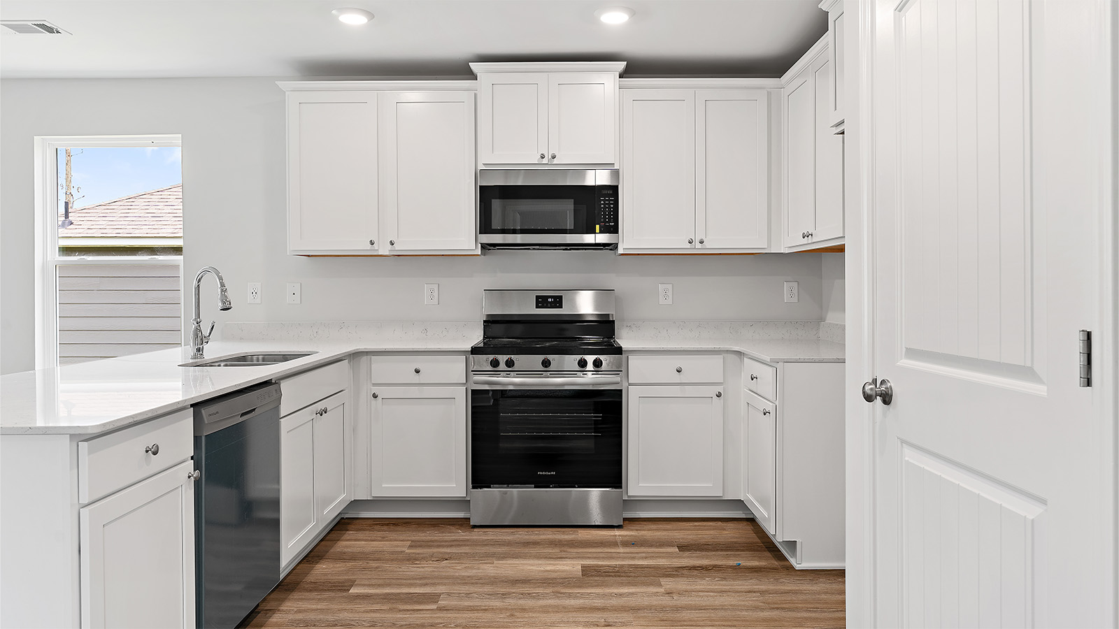 Stylish kitchen with stainless steel appliances and large island