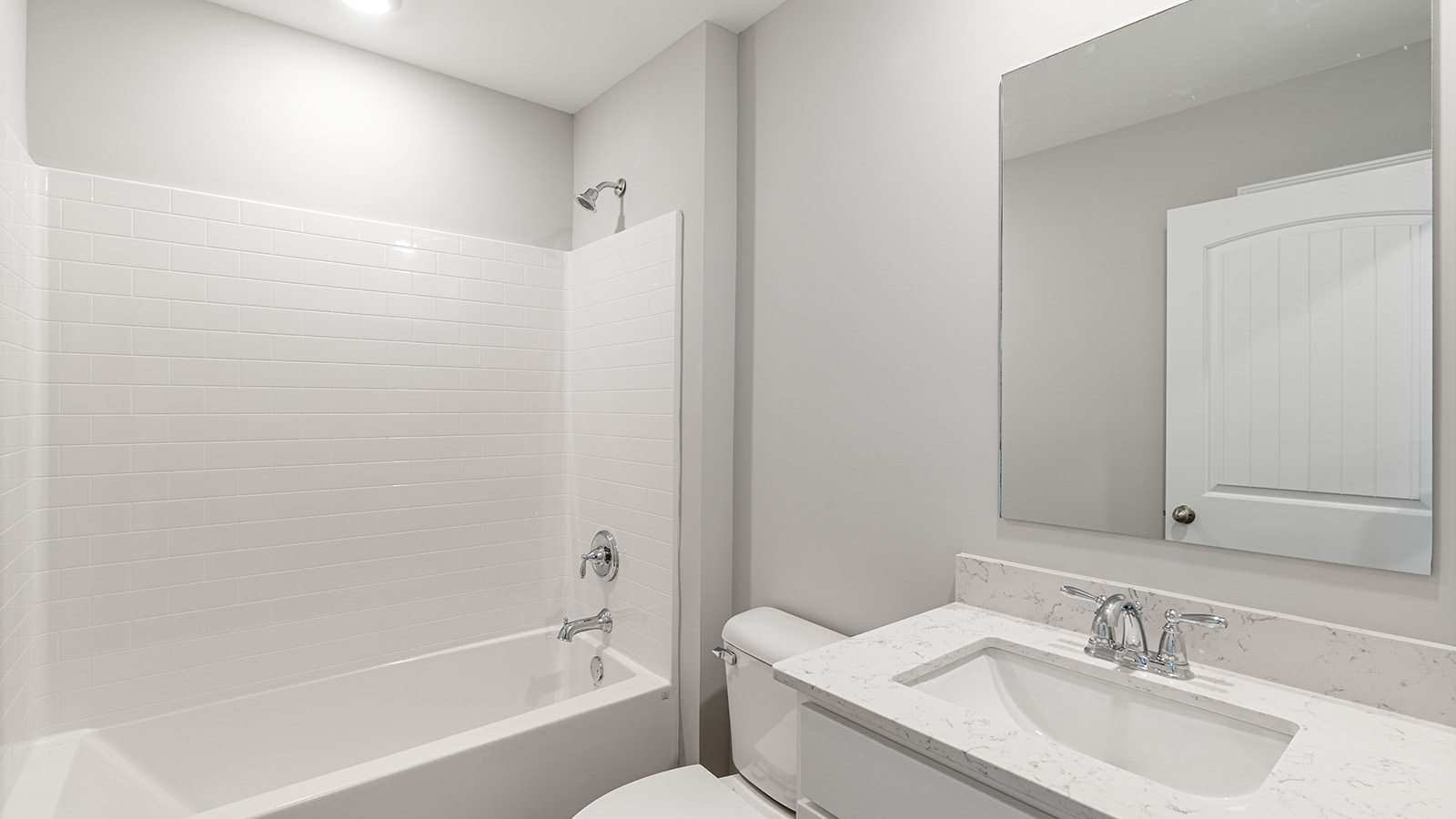 luxury vinyl plan flooring in bathrooms with quartz countertops