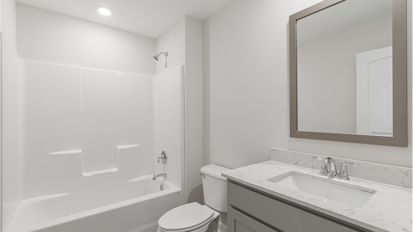 luxury vinyl plan flooring in bathrooms with quartz countertops