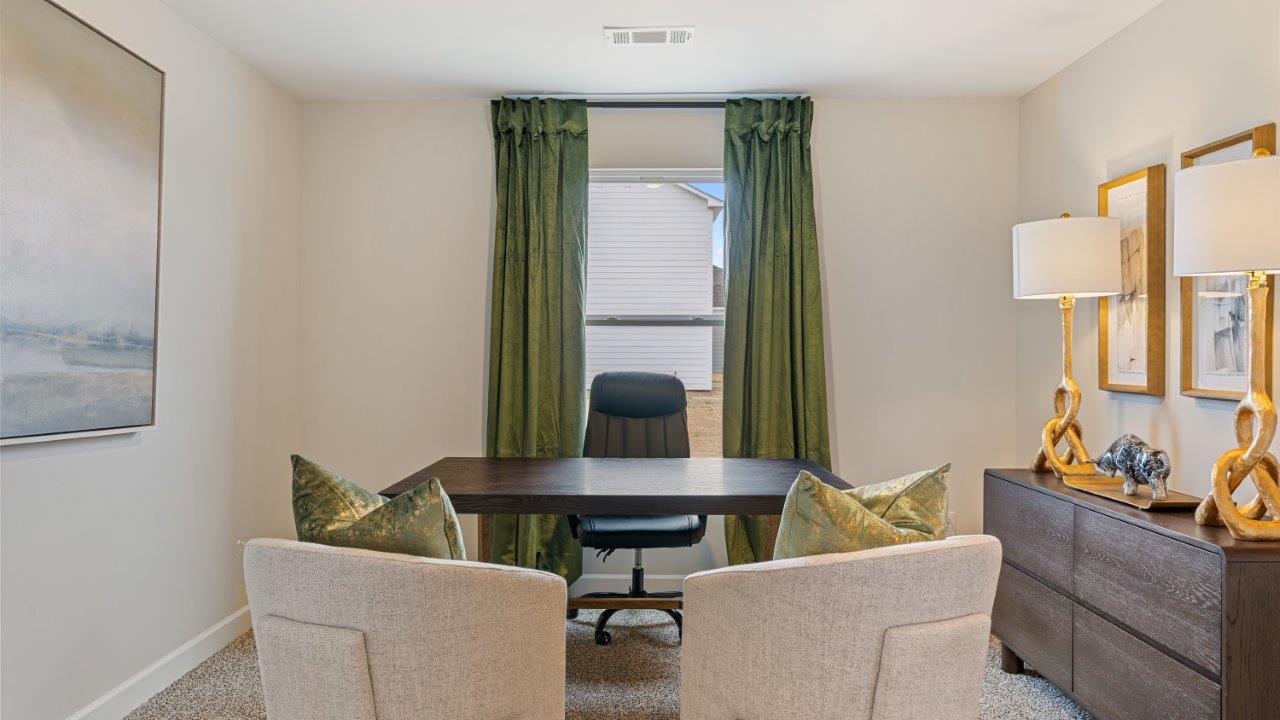 Well appointed guest room featuring carpet flooring and a roomy closet.