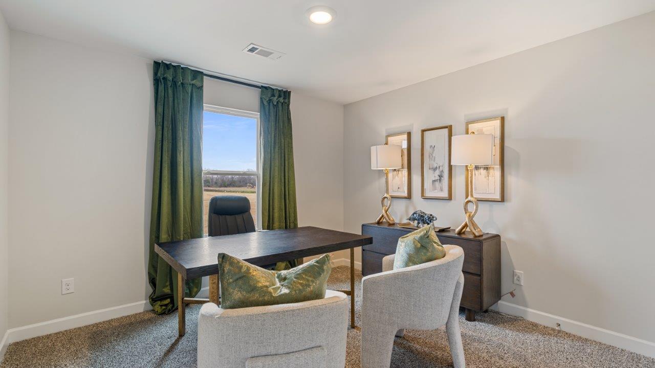 Well appointed guest room featuring carpet flooring and a roomy closet.