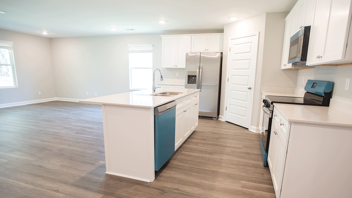 Bright living space featuring durable LVP and an easy, open layout.