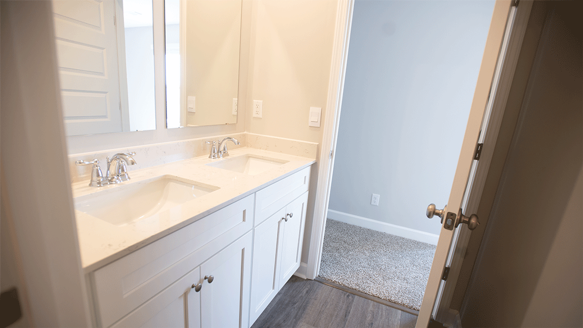 Guest ready bathroom with a practical tub/shower combo and neutral finishes.