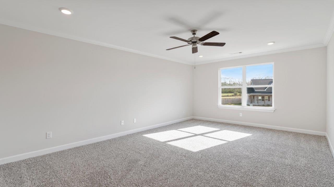 The Carol floorplan interior with quartz countertops, LVP flooring, and open layout.