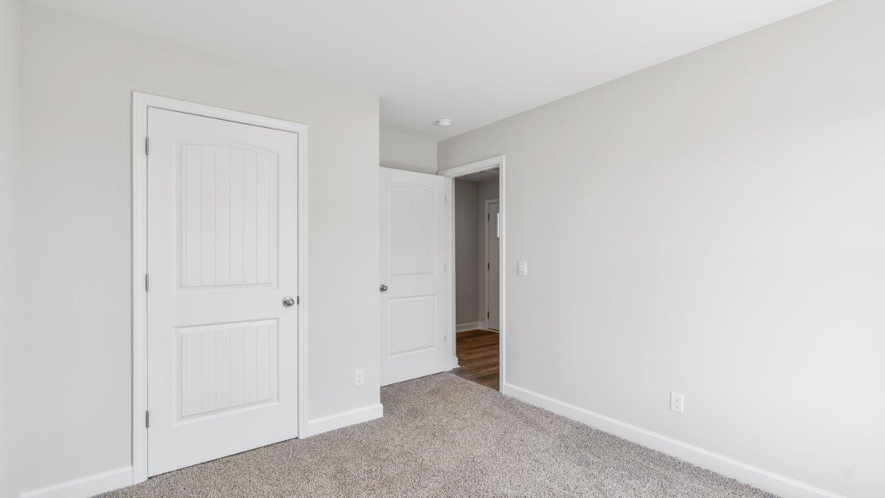 The Riverside floorplan with quartz countertops, LVP flooring, and open concept living