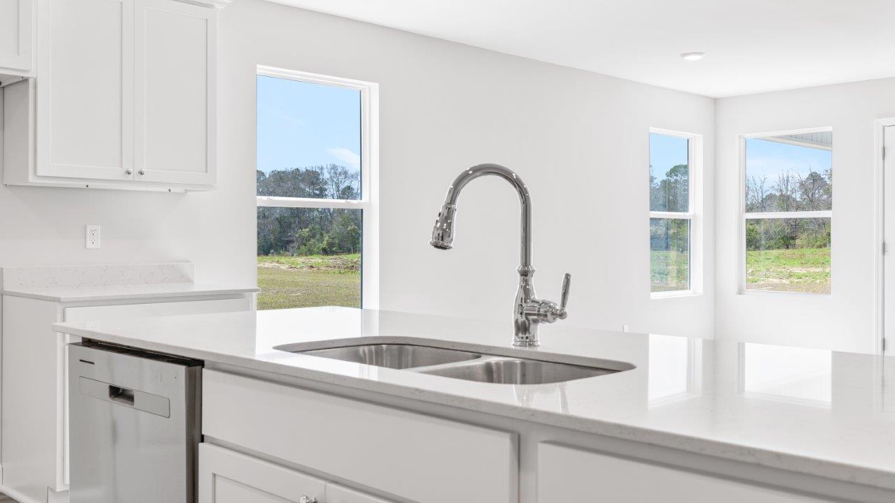 The Riverside floorplan with quartz countertops, LVP flooring, and open concept living