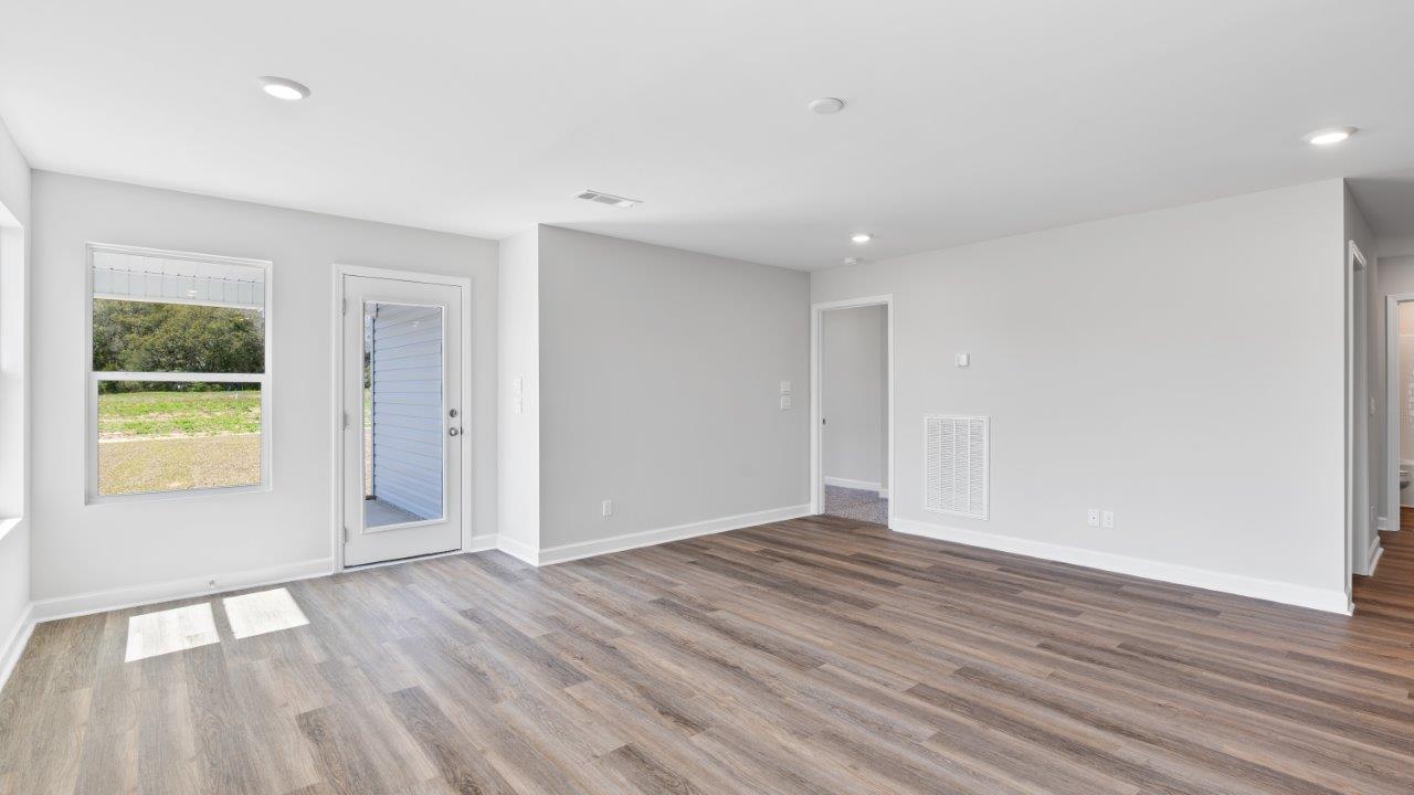 The Riverside floorplan with quartz countertops, LVP flooring, and open concept living