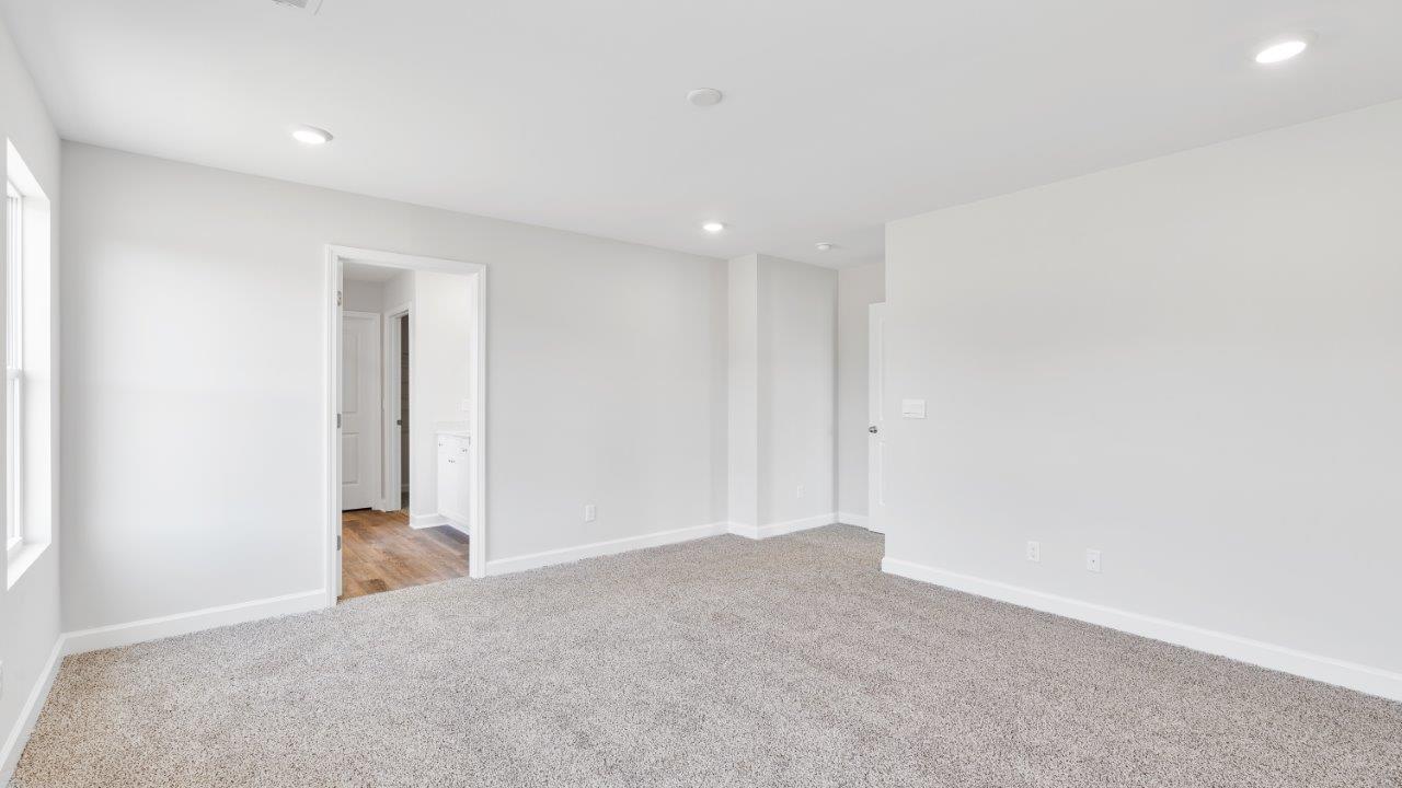 The Riverside floorplan with quartz countertops, LVP flooring, and open concept living