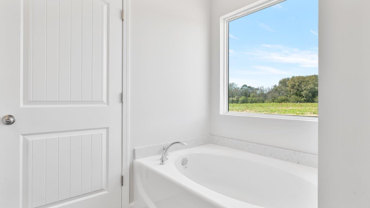 The Riverside floorplan with quartz countertops, LVP flooring, and open concept living