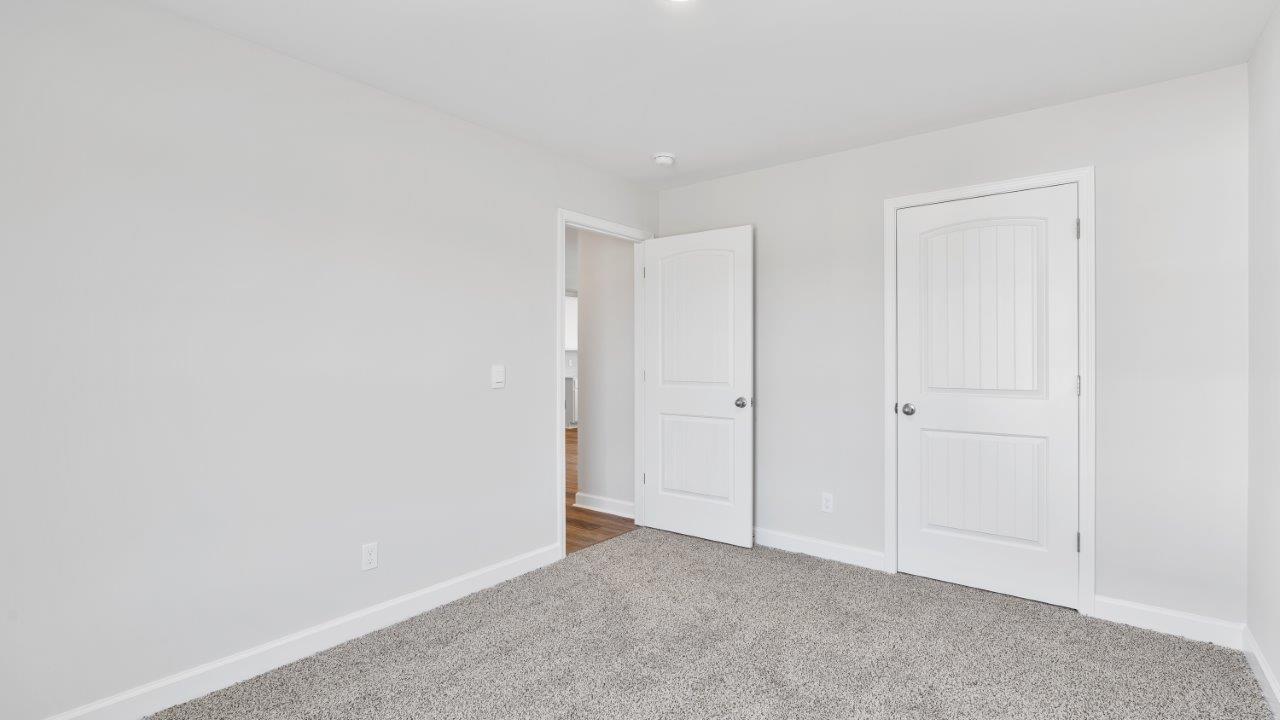 The Riverside floorplan with quartz countertops, LVP flooring, and open concept living