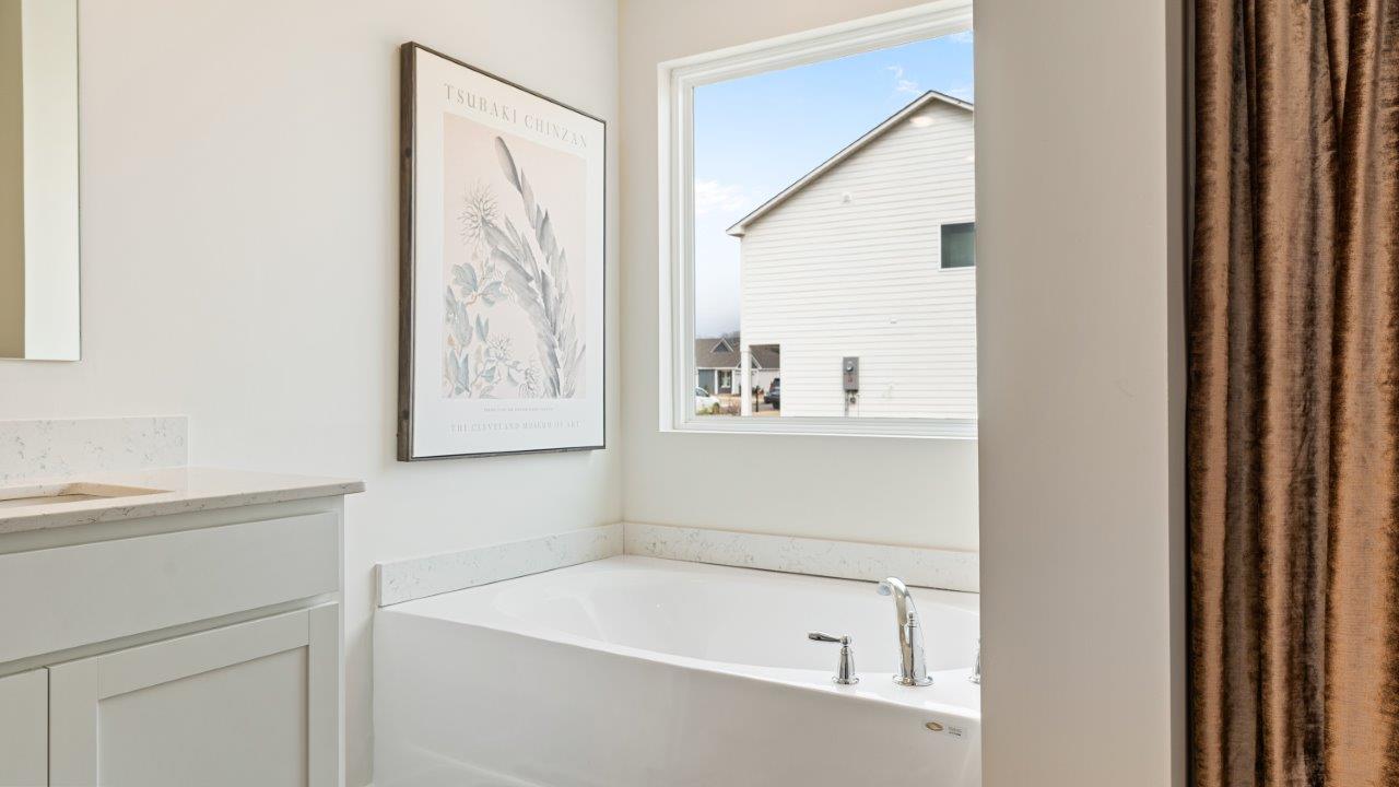 luxury vinyl plan flooring in bathrooms with quartz countertops