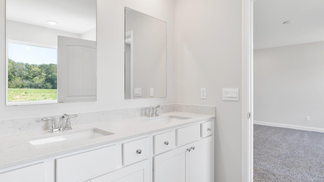 luxury vinyl plan flooring in bathrooms with quartz countertops