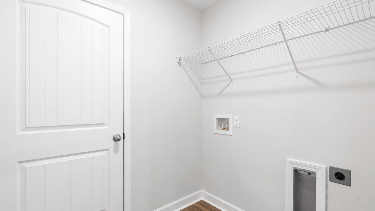 laundry room with luxury vinyl plank flooring