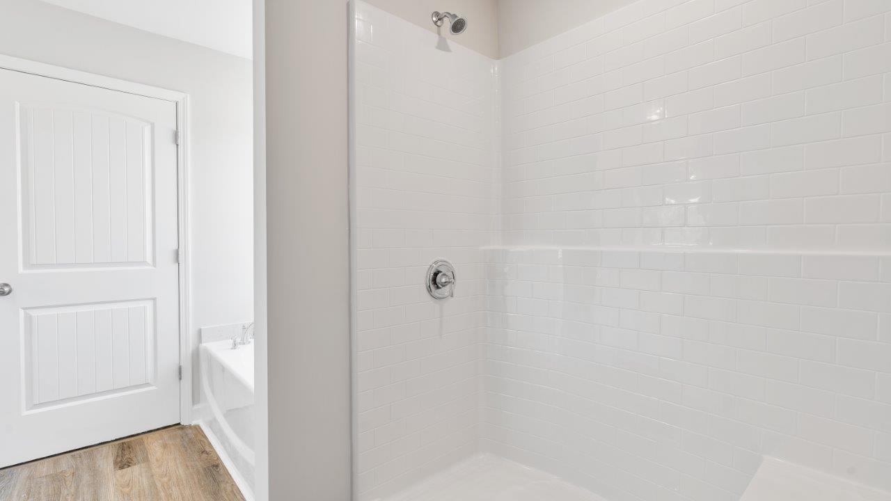 luxury vinyl plan flooring in bathrooms with quartz countertops