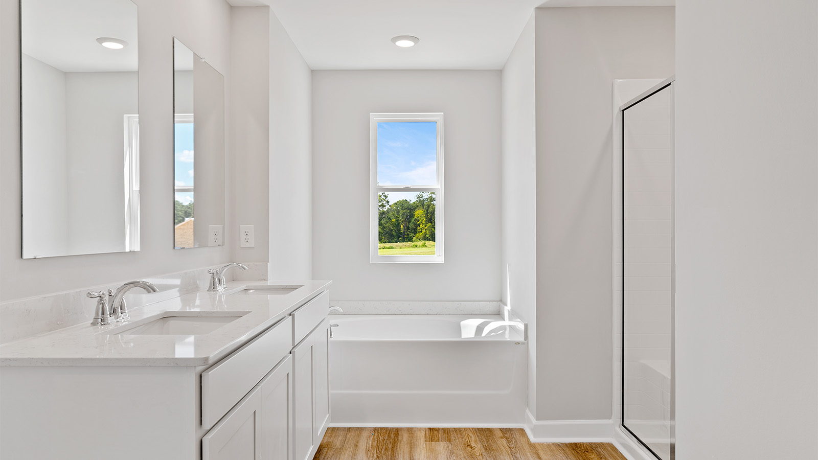 luxury vinyl plan flooring in bathrooms with quartz countertops