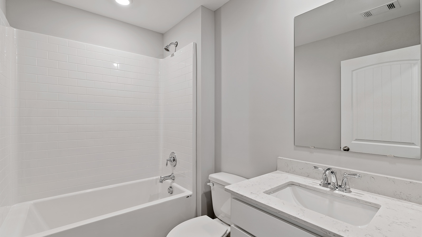 luxury vinyl plan flooring in bathrooms with quartz countertops