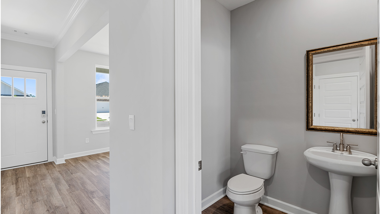 luxury vinyl plan flooring in bathrooms with quartz countertops