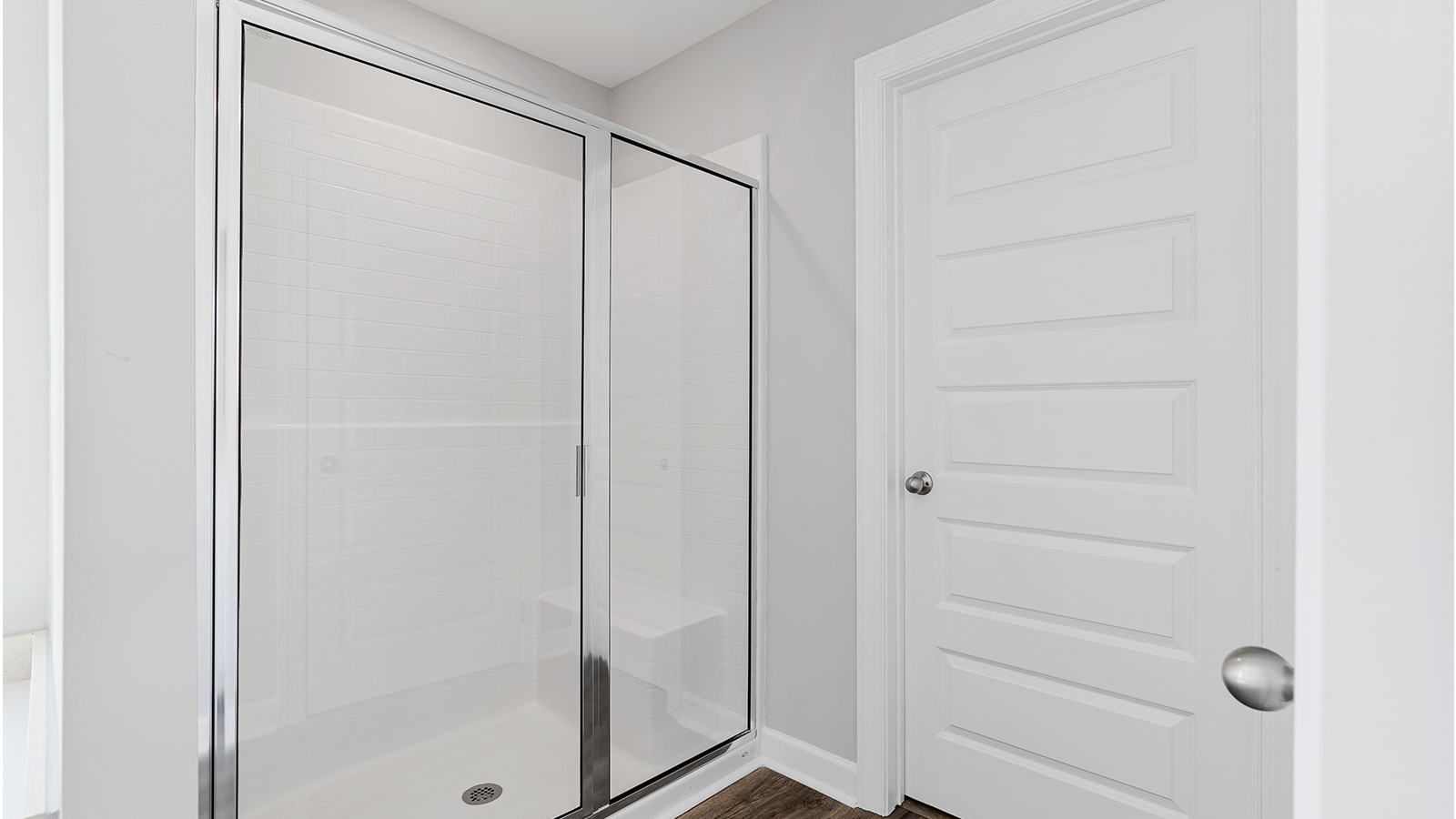 luxury vinyl plan flooring in bathrooms with quartz countertops