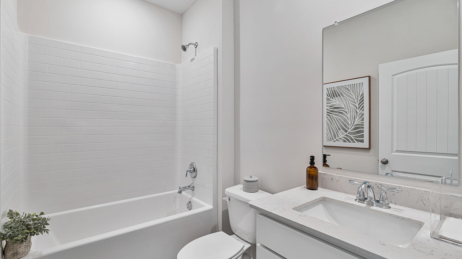 luxury vinyl plan flooring in bathrooms with quartz countertops