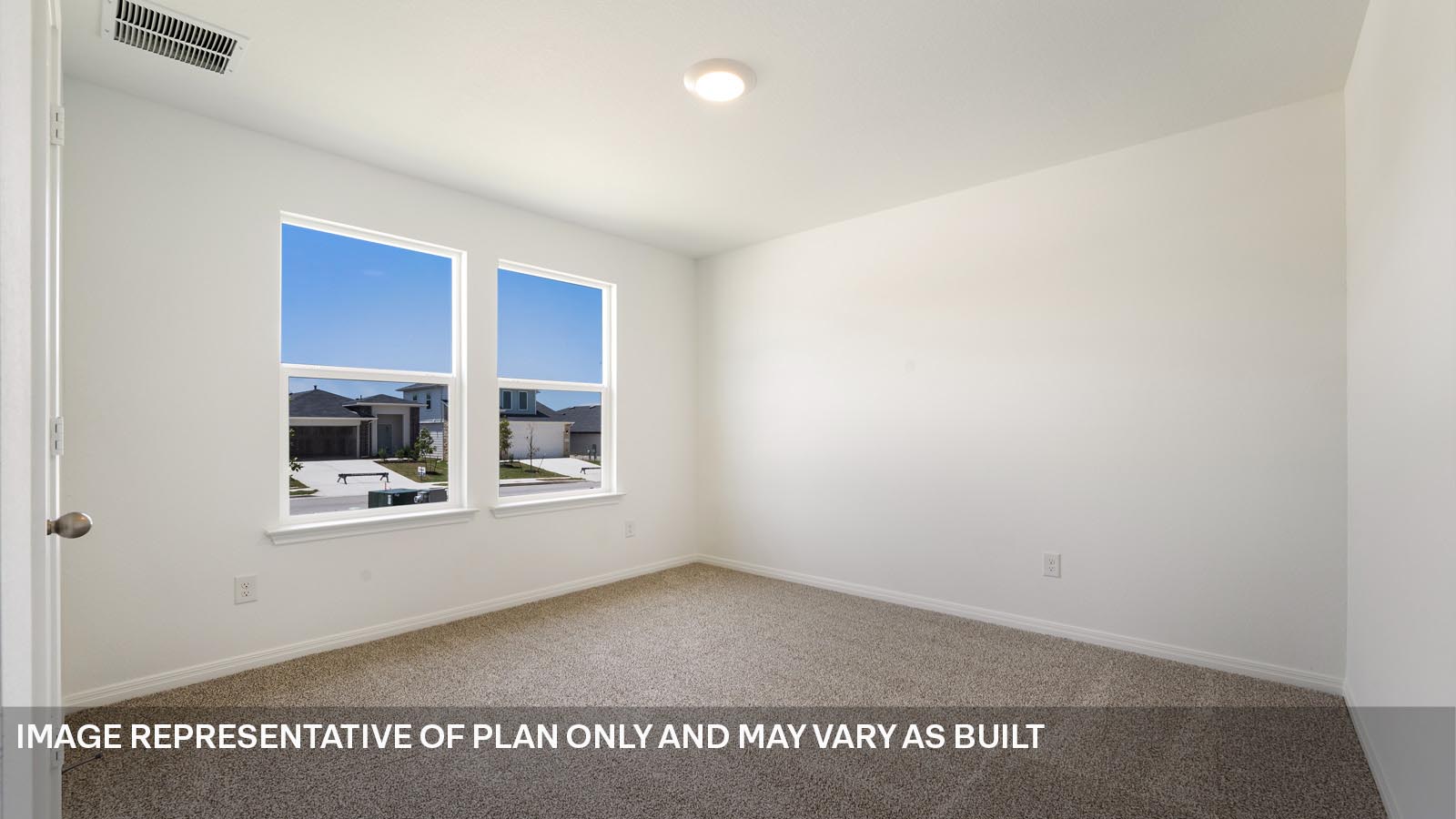 Bedroom 2 with two windows.