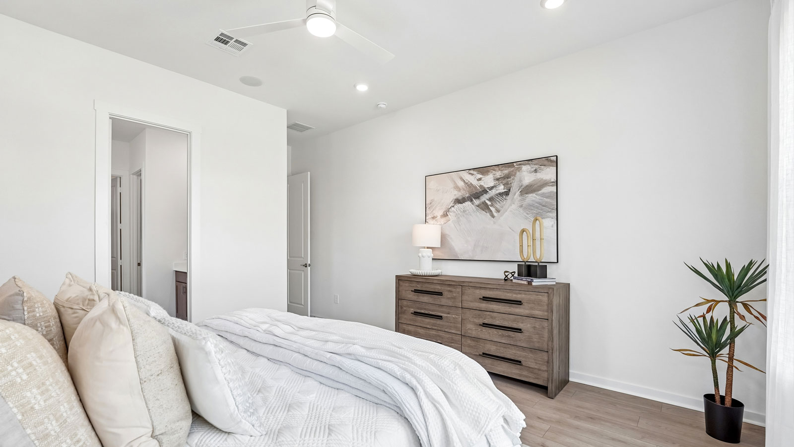Spacious main bedroom with plenty of windows and natural light.