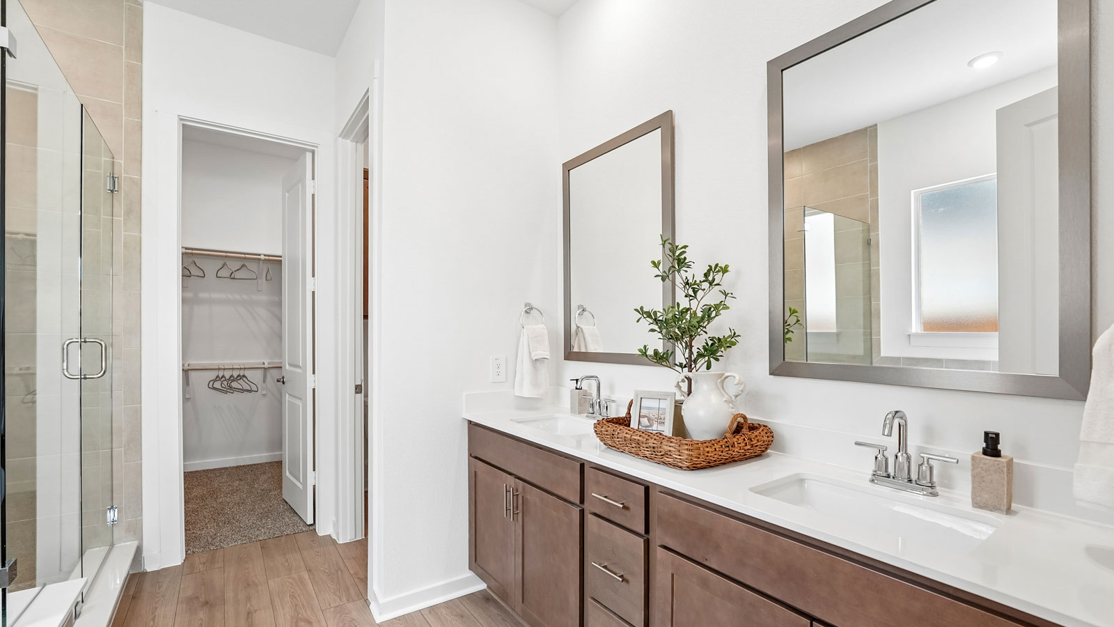 Main bathroom with frameless shower and stand alone bathtub.