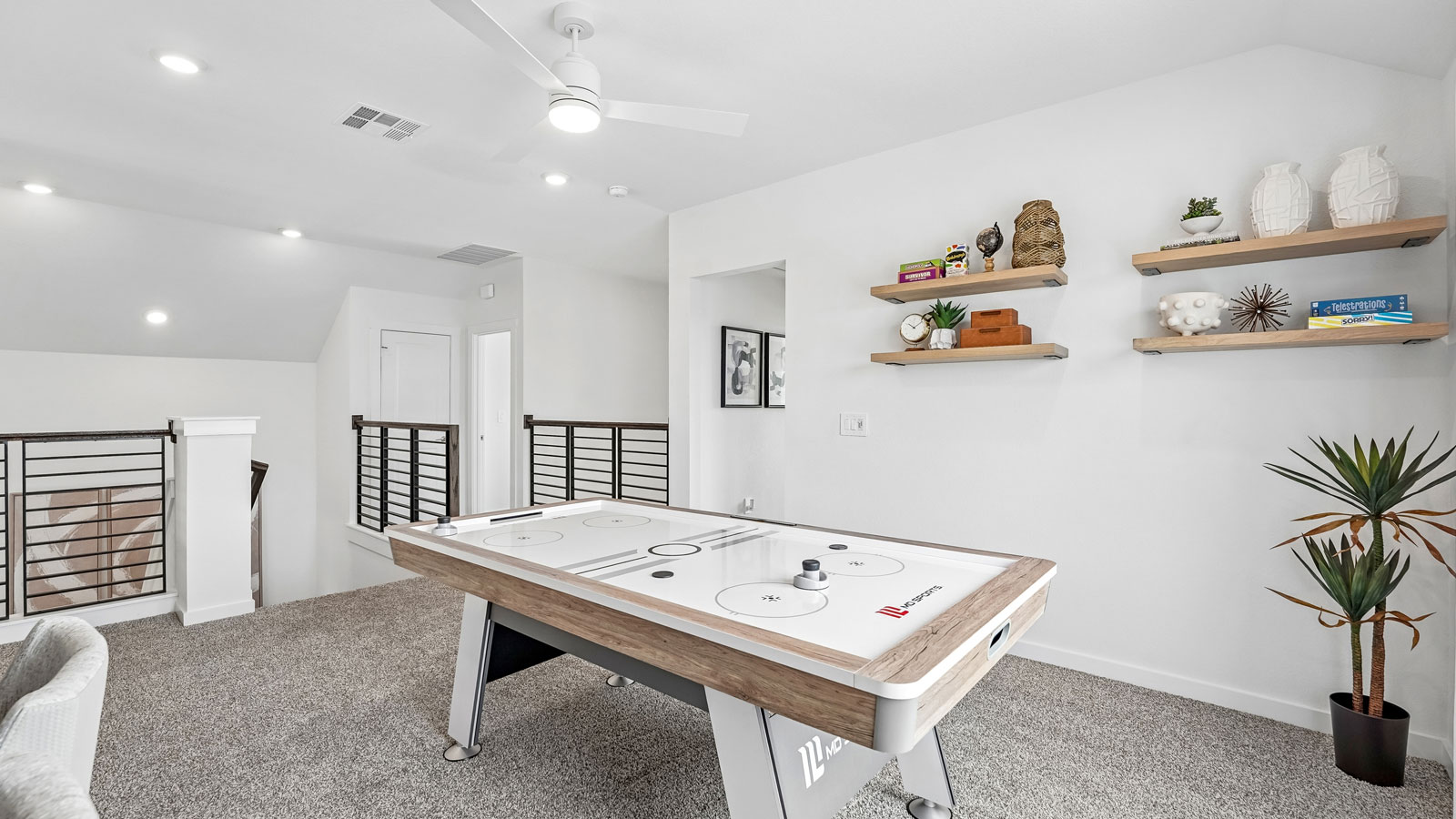 Upstairs game room open to below.