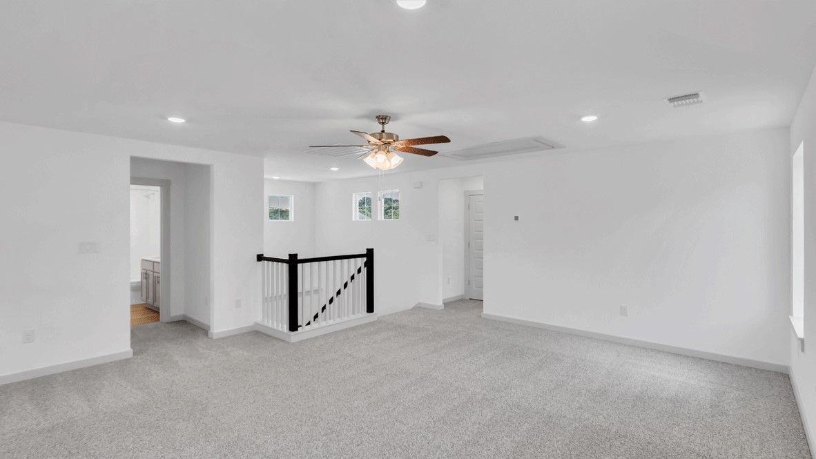 Loft + Secondary Bedroom Loft and bedroom layout provides zoned living and sleeping areas for remote work, study, or visitors in this New Home For Sale