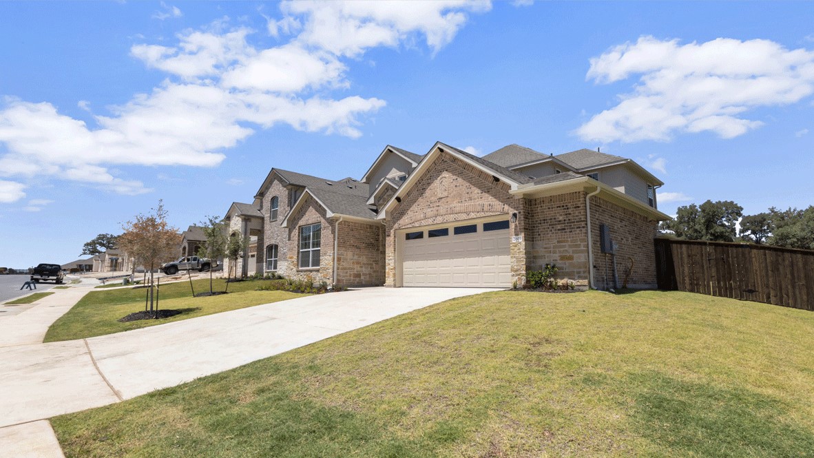 2-Story 2 tone-sand color and brick accents new home construction