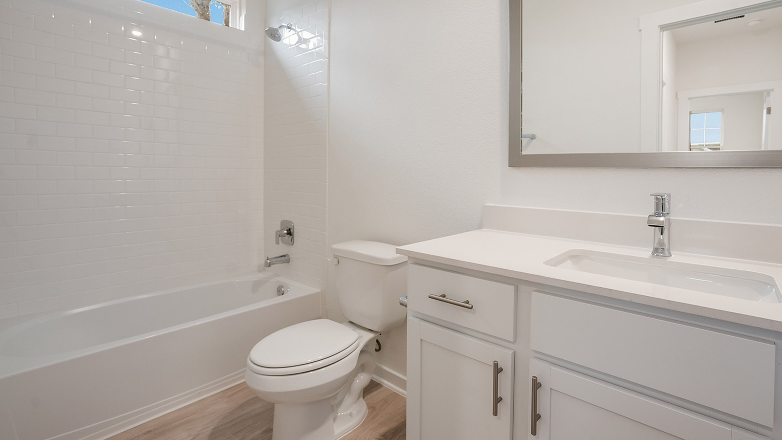 Bathroom 2 with single vanity sink and bathtub.