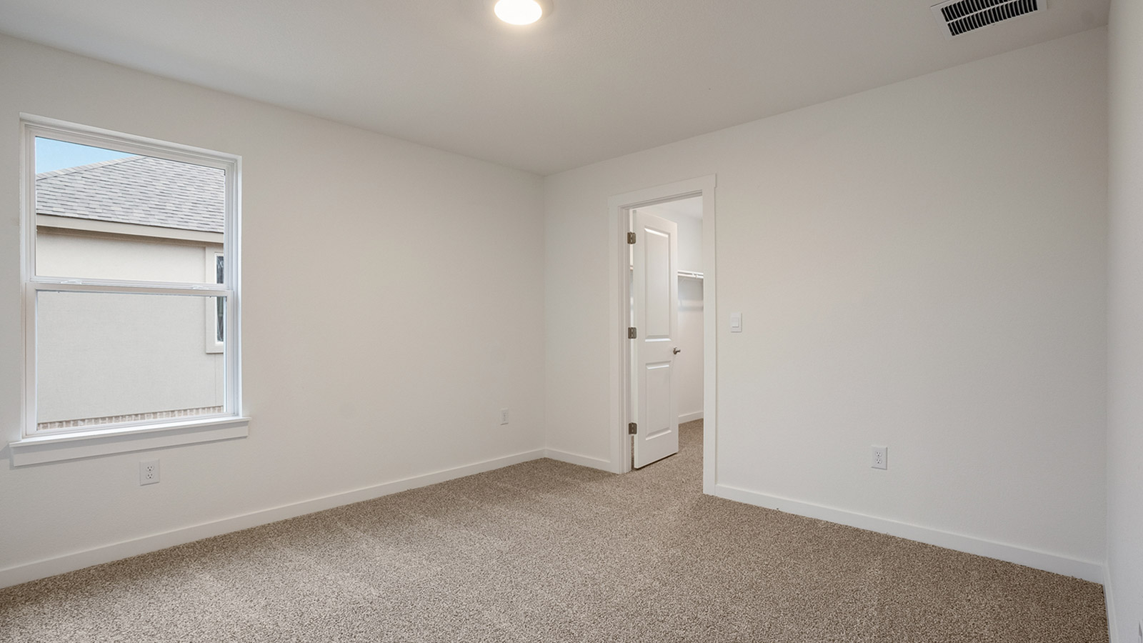 Bedroom 3 located upstairs with carpeted floors.
